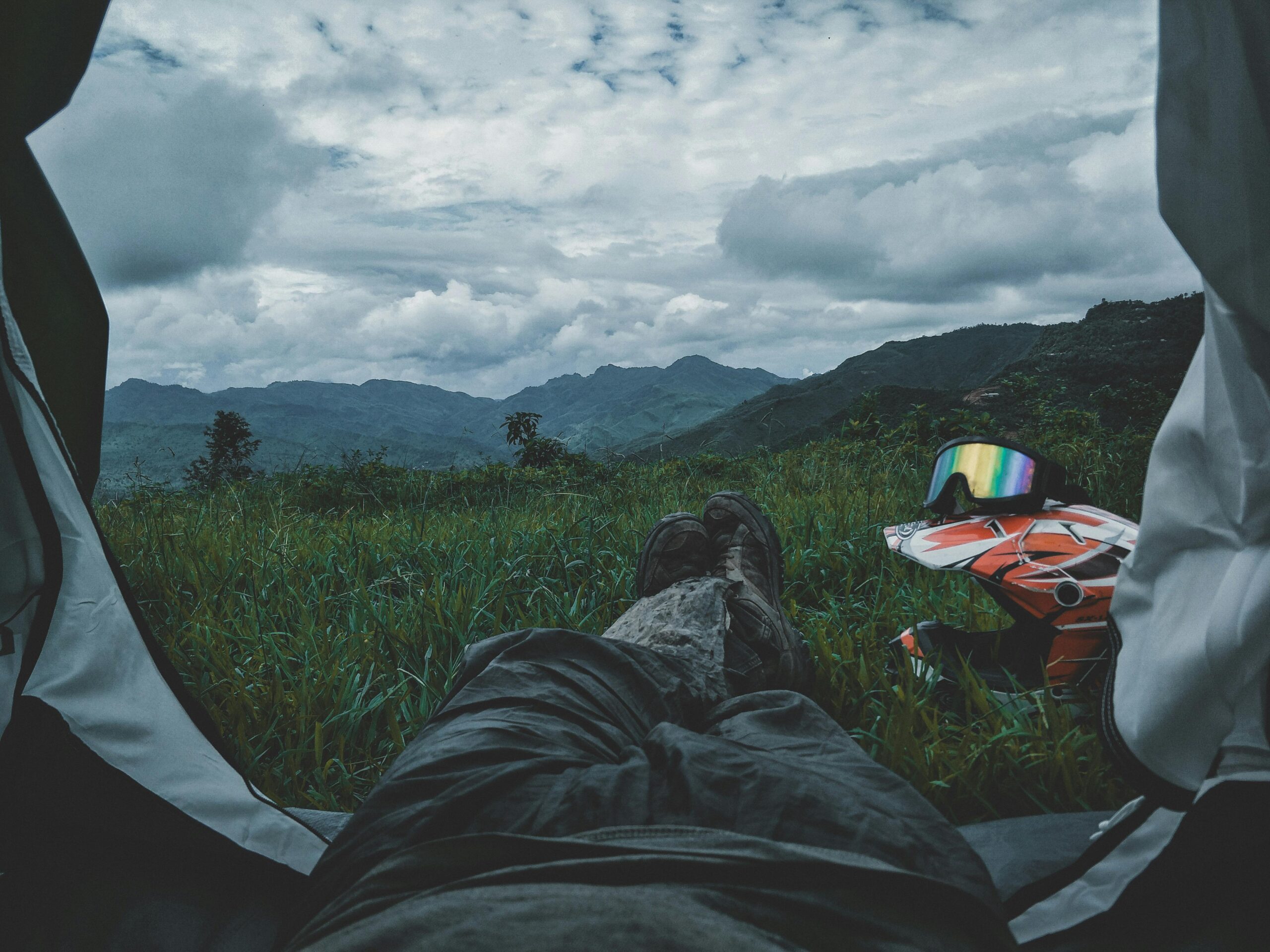 Enjoying the view of lush mountains from a tent in Mon Village, India.
